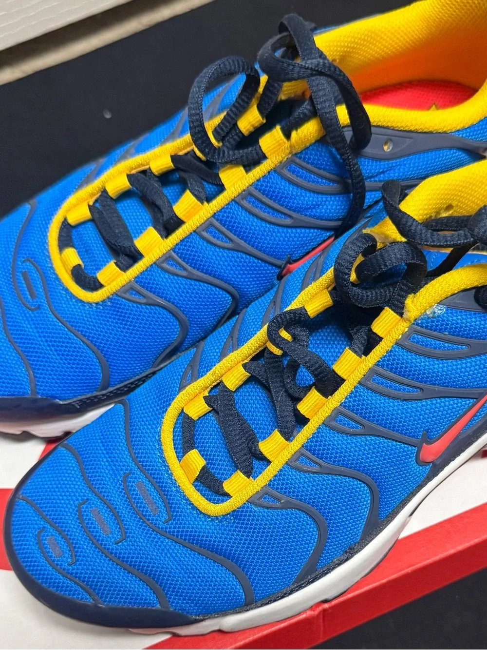 Nike Kids Blue Sneakers with Yellow Trim and Red Swoosh